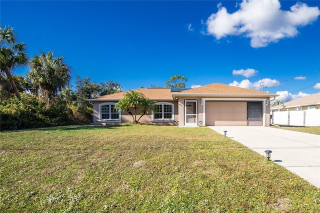 ranch-style house with a garage and a front lawn