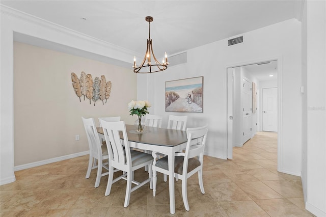 dining area with light tile patterned flooring and an inviting chandelier