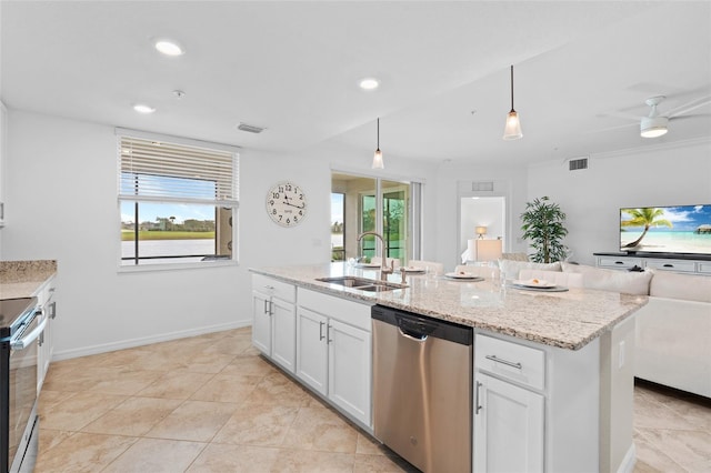 kitchen featuring hanging light fixtures, sink, a wealth of natural light, appliances with stainless steel finishes, and white cabinetry