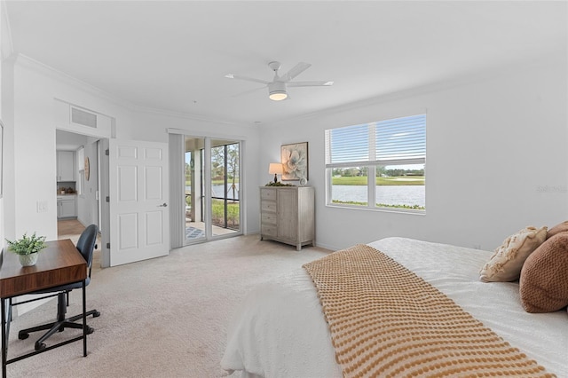 carpeted bedroom featuring access to outside, ceiling fan, and crown molding