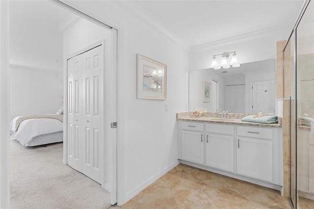 bathroom featuring vanity, ornamental molding, and a shower with door