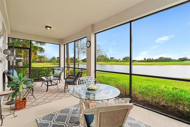 sunroom / solarium with a water view