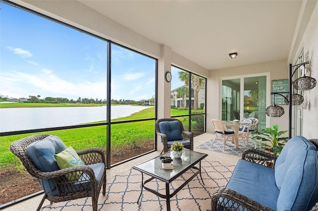 sunroom / solarium with a water view