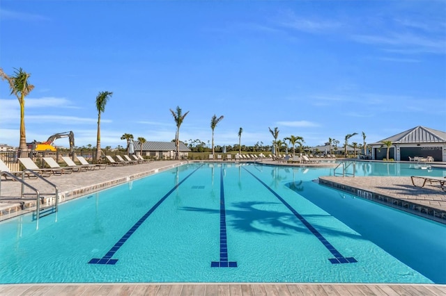 view of swimming pool with a patio area