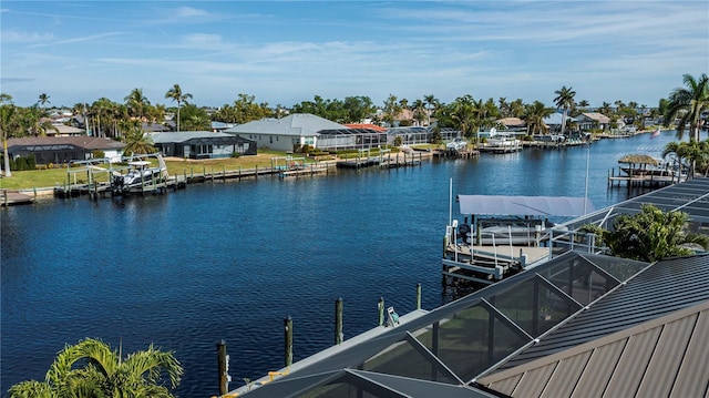 view of dock featuring glass enclosure and a water view