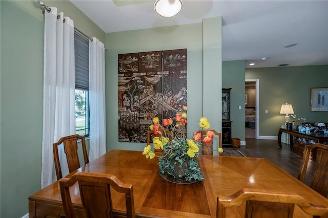 dining area featuring dark hardwood / wood-style flooring