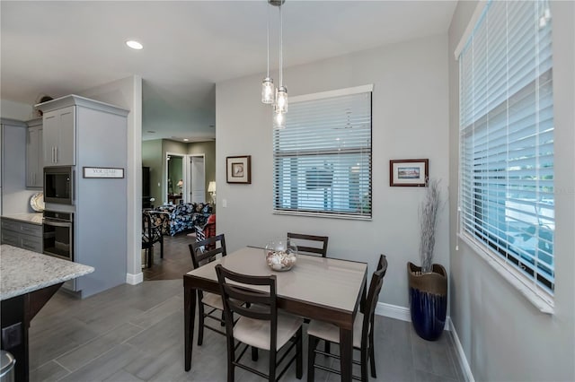 dining area featuring light hardwood / wood-style flooring and plenty of natural light