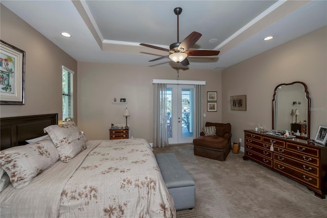 bedroom featuring french doors, a raised ceiling, ceiling fan, access to exterior, and light colored carpet