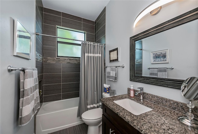 full bathroom with shower / tub combo, vanity, and toilet