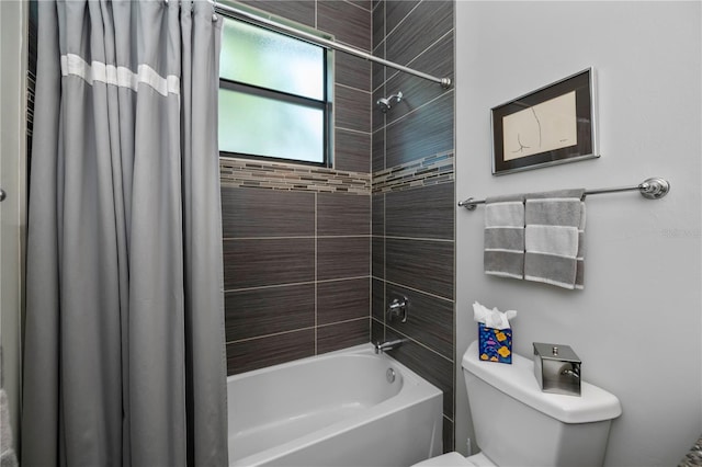 bathroom with shower / bath combination with curtain and toilet