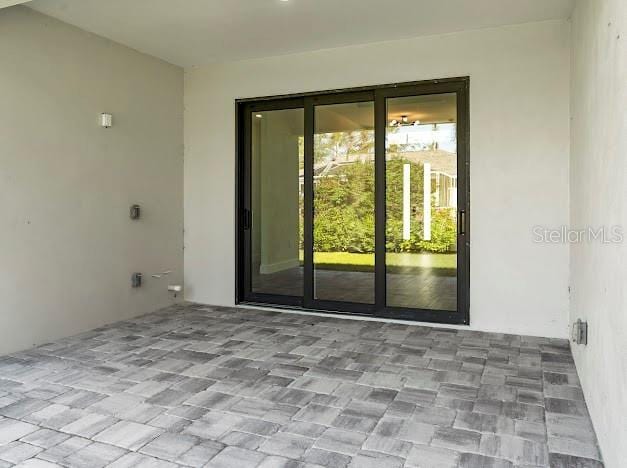 doorway to property featuring a patio