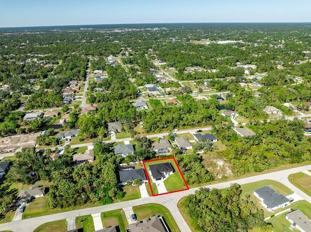 birds eye view of property with a residential view