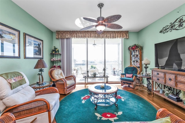 living room with hardwood / wood-style floors and ceiling fan