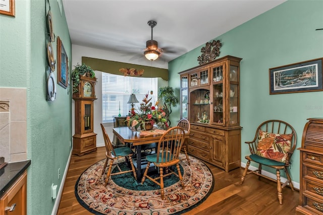 dining room featuring dark hardwood / wood-style floors and ceiling fan