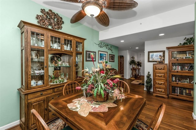 dining room featuring ceiling fan and dark wood-type flooring