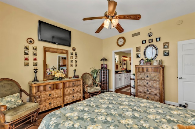 bedroom featuring ceiling fan, wood-type flooring, and ensuite bath