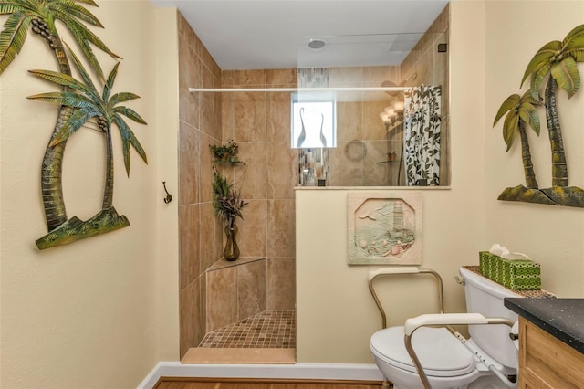 bathroom with a shower with shower curtain, vanity, toilet, and hardwood / wood-style flooring