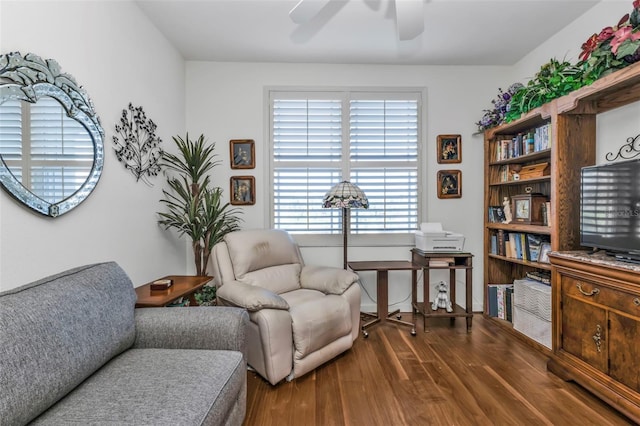 sitting room with hardwood / wood-style flooring and ceiling fan