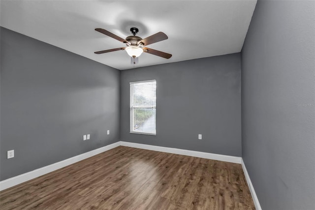 unfurnished room with hardwood / wood-style floors and ceiling fan