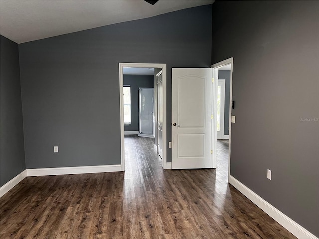 empty room with dark hardwood / wood-style floors