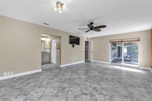 unfurnished living room with ceiling fan