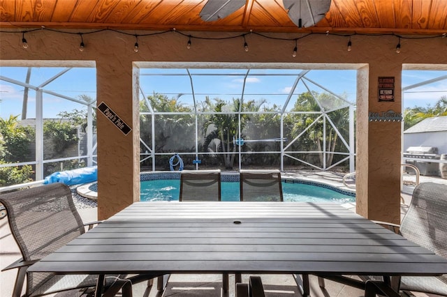 view of pool featuring grilling area