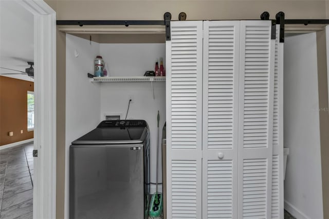 laundry area with tile patterned flooring, washer / clothes dryer, and ceiling fan