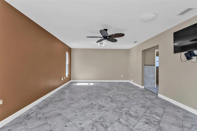 23309 Hartley Ave, Port Charlotte, FL 33954 - unfurnished room with visible vents, baseboards, a ceiling fan, and marble finish floor