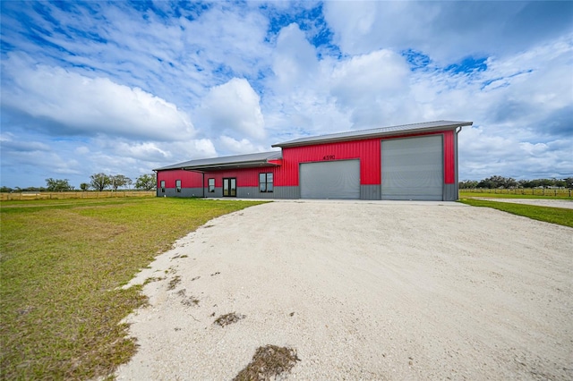 exterior space with an outbuilding and a front yard