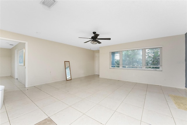 unfurnished room with ceiling fan and light tile patterned floors