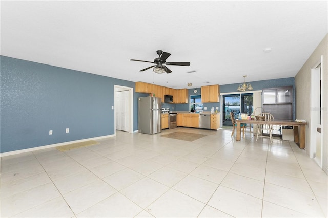 unfurnished living room with light tile patterned floors and ceiling fan with notable chandelier