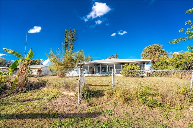 rear view of house with a sunroom