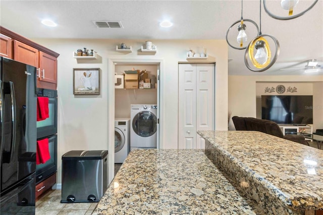 laundry room featuring light tile patterned floors