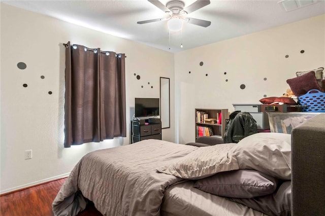 bedroom featuring ceiling fan and wood-type flooring