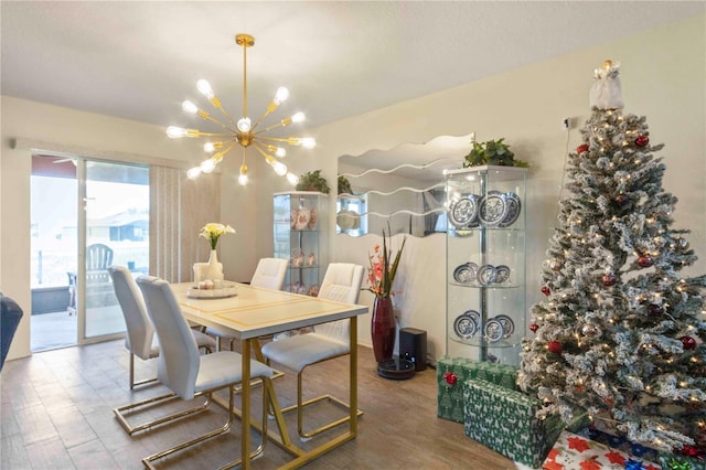 dining area featuring light hardwood / wood-style floors and a chandelier