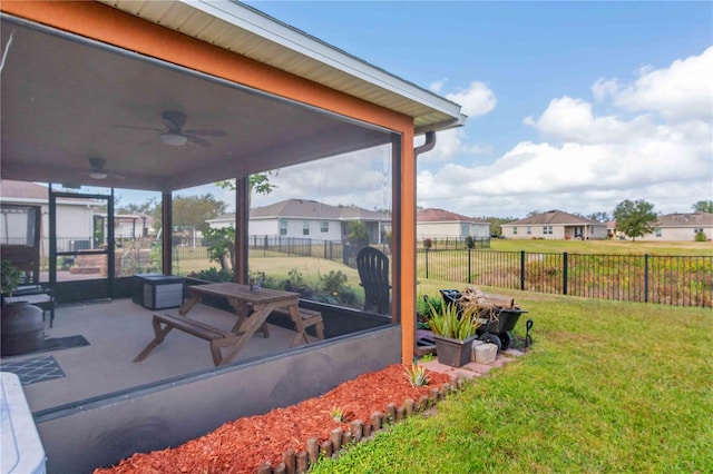 view of yard with ceiling fan