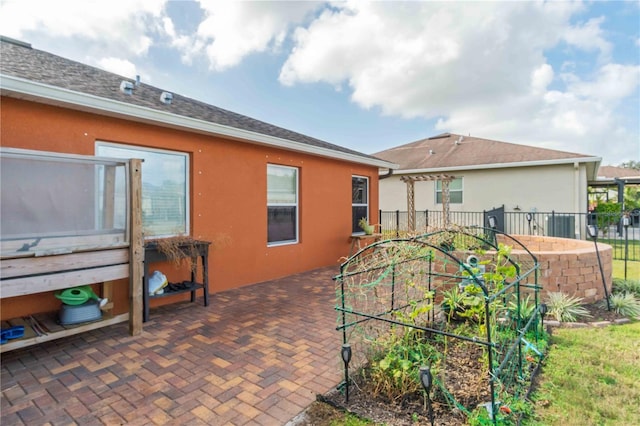 rear view of property featuring a patio