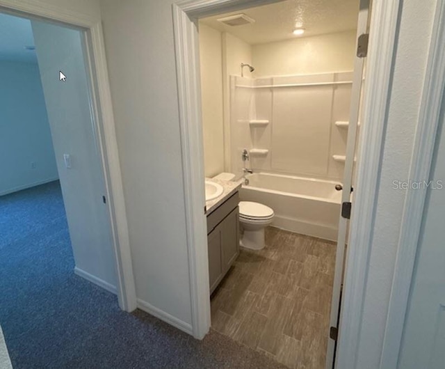 full bathroom featuring vanity, toilet, and shower / bathtub combination