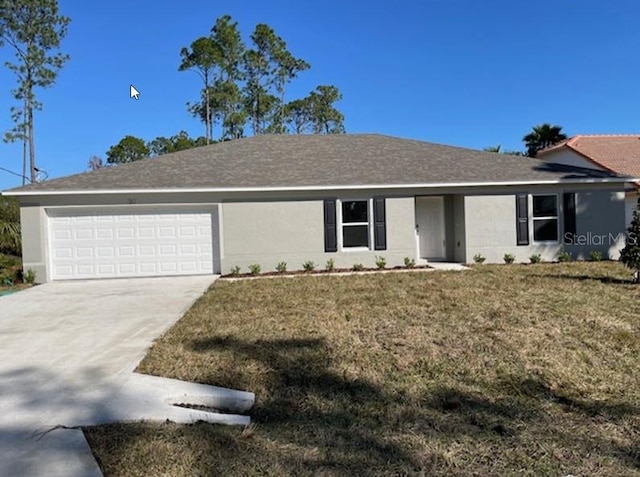 ranch-style home with a garage and a front lawn