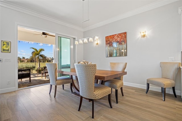 dining area with ceiling fan, light hardwood / wood-style floors, and ornamental molding