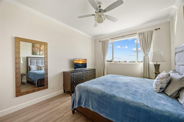 bedroom featuring ceiling fan, crown molding, and light wood-type flooring