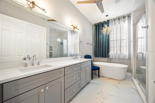 bathroom featuring plus walk in shower, vanity, and ceiling fan