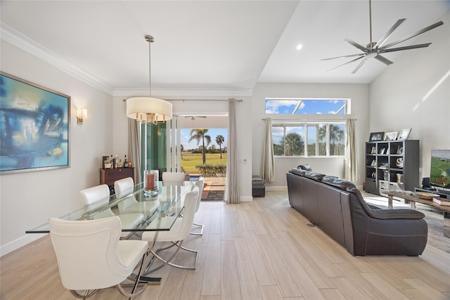 dining area with light wood-type flooring, ceiling fan, and crown molding