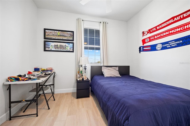 bedroom featuring ceiling fan and light hardwood / wood-style floors