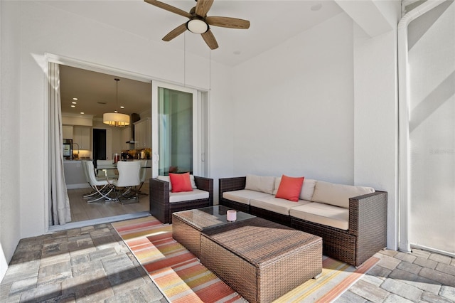 view of patio featuring outdoor lounge area and ceiling fan