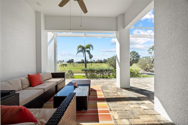 view of patio / terrace with an outdoor living space and ceiling fan