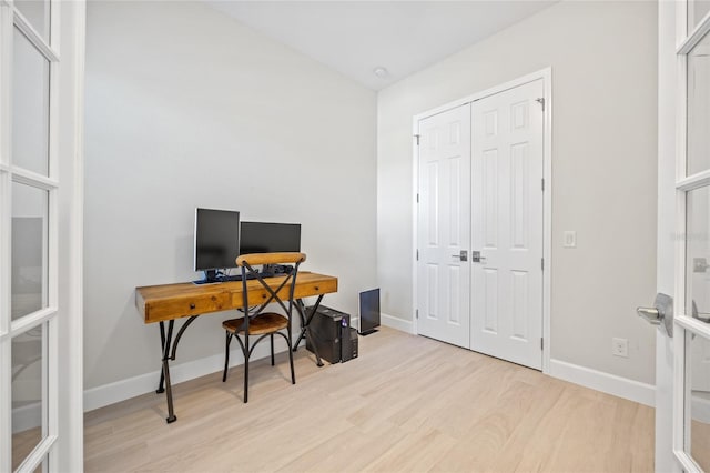 office space with light hardwood / wood-style floors