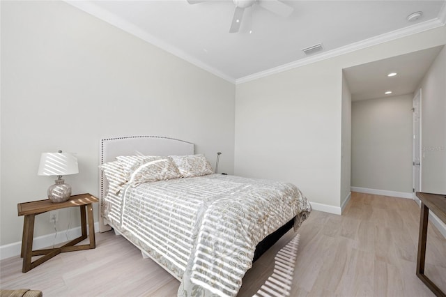 bedroom with ceiling fan, ornamental molding, and light hardwood / wood-style flooring