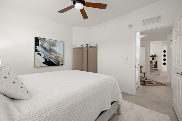 bedroom with light tile patterned floors and ceiling fan