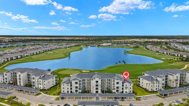 drone / aerial view featuring a water view and golf course view